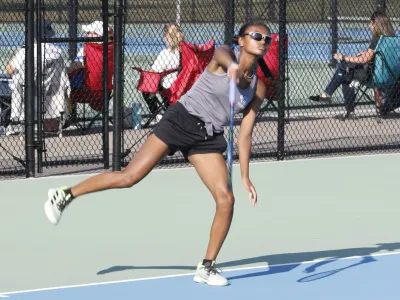 Worthington Kilbourne senior Tyra Butler follows through on a serve during a Sept. 8 match against Gahanna Lincoln's Audrey Goh. Butler, who qualified for the Division I state tournament in doubles in 2023, has played No. 1 singles throughout the regular season.