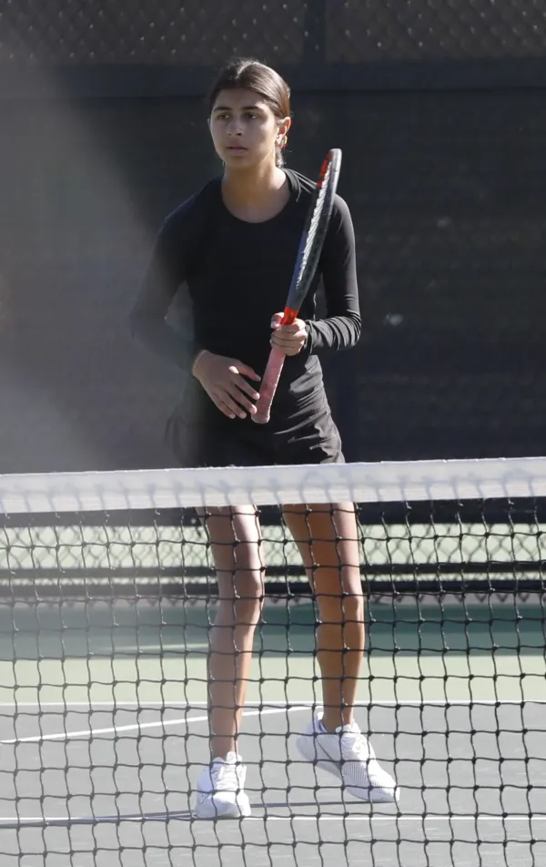 Columbus School for Girls' Priya Mehta prepares for a serve during a Division II state doubles quarterfinal match in October 2024. Mehta will play doubles with Victoria Dizon again this postseason.