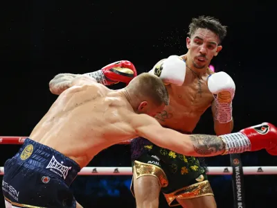 DUBLIN, IRELAND - SEPTEMBER 05: Michael Conlan knocks down Jack Bateson during the WBC International Featherweight fight between Michael Conlan and Jack Bateson during the Return of the Mick fight night at The 3Arena Dublin on September 05, 2025 in Dublin, Ireland. (Photo by Charles McQuillan/Getty Images)