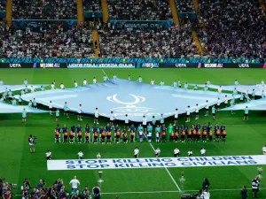 Banners reading ‘Stop killing children. Stop killing civilians’ were displayed before the Uefa Super Cup match between Tottenham and PSG last month (Reuters)