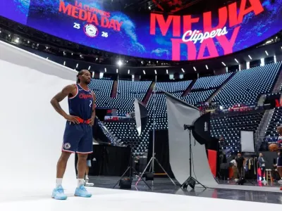 Los Angeles Clippers forward Kawhi Leonard (2) and guard Chris Paul (3) pose during the NBA basketball team's media day Monday, Sept. 29, 2025, in Inglewood, Calif. (AP Photo/Eric Thayer)