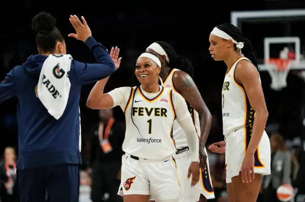 Sept. 21: The Indiana Fever's Odyssey Sims (1) celebrates with teammates during the Fever's 89-73 Game 1 win over the Las Vegas Aces at Michelob Ultra Arena.
