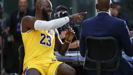 El Segunda, CA, Monday, September 29, 2025 - LeBron James shares a laugh with James Worthy and others during a television interview at media day at UCLA Health Training Center. (Robert Gauthier/Los Angeles Times)