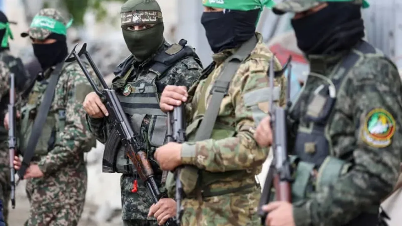 Hamas members stand at the funeral of Marwan Issa, a senior Hamas deputy military commander who was killed in an Israeli airstrike during the conflict between Israel and Hamas, in the central Gaza Strip, February 7, 2025. (photo credit: Ramadan Abed/Reuters)