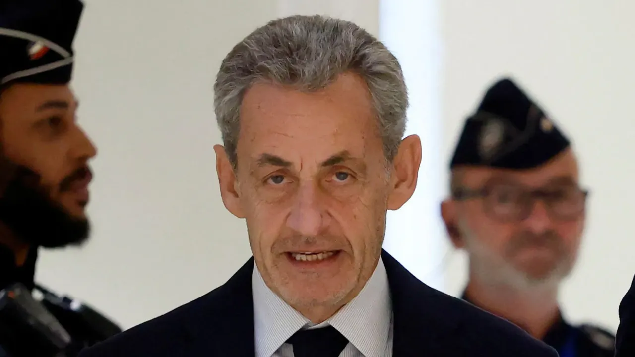 Nicolas Sarkozy arrives for the verdict in his trial on charges of corruption and illegal financing of an election campaign related to alleged Libyan funding of his successful 2007 presidential bid, at the courthouse in Paris, on 25 September 2025.