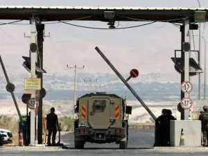 An Israeli military vehicle waits at a barrier, at the Allenby Bridge Crossing between the West Bank and Jordan, September 8, 2024. (photo credit: REUTERS/AMMAR AWAD)