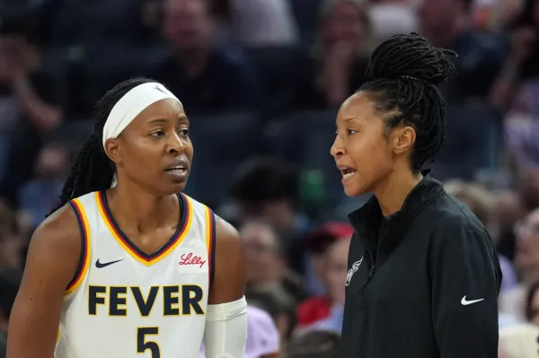 Aug 31, 2025; San Francisco, California, USA; Indiana Fever assistant coach Briann January (right) talks with guard Shey Peddy (5) during the second quarter against the Golden State Valkyries at Chase Center. Mandatory Credit: Darren Yamashita-Imagn Images