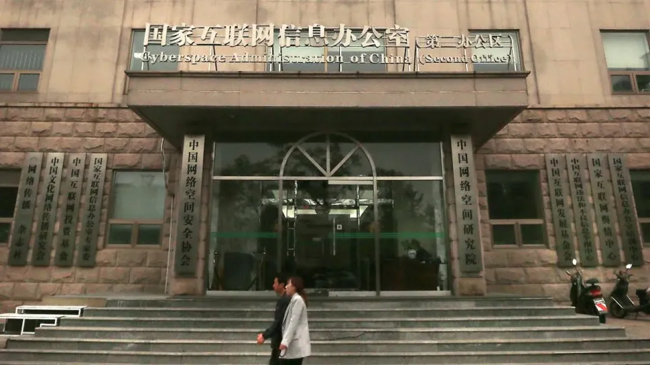 Chinese walk past a nondescript building housing the Cyberspace Administration of China&#39;s second office in Beijing on November 6, 2017. - Stephen Shaver/UPI/Shutterstock