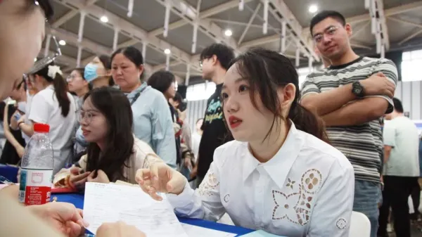 Job seekers look for opportunities at a job fair mostly for overseas returnees and PhD holders in Nanjing in east China's Jiangsu province on September 20, 2025. - FEATURECHINA/Newscom/Sipa
