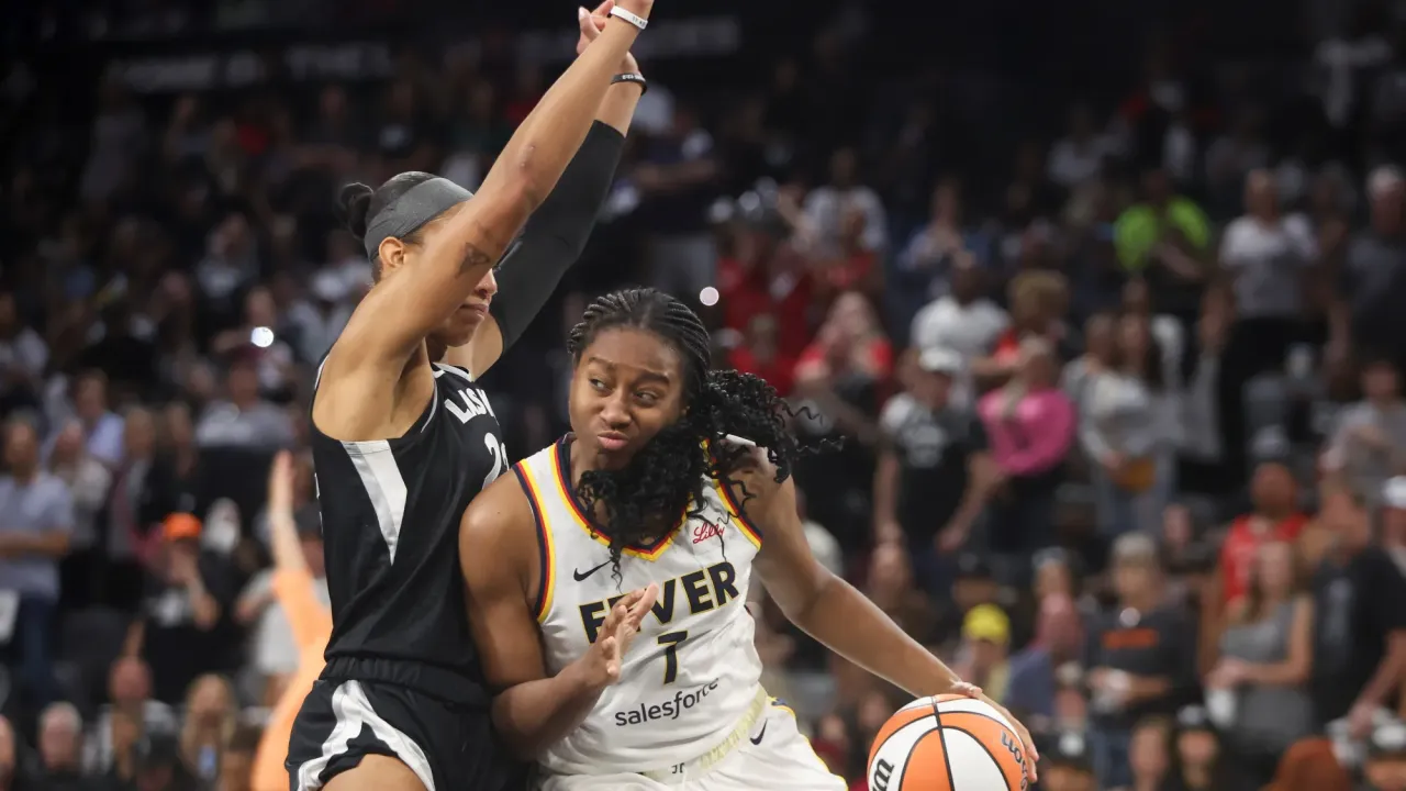 LAS VEGAS, NEVADA - SEPTEMBER 23: Aliyah Boston #7 of the Indiana Fever drives against A'ja Wilson #22 of the Las Vegas Aces in the fourth quarter of a game of Game Two of the 2025 WNBA Playoffs semifinals at Michelob ULTRA Arena on September 23, 2025 in Las Vegas, Nevada. NOTE TO USER: User expressly acknowledges and agrees that, by downloading and or using this photograph, User is consenting to the terms and conditions of the Getty Images License Agreement. (Photo by Ian Maule/Getty Images)