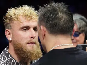 Oleksandr Usyk faces up to Jake Paul (left) after winning his IBF, IBO, WBC and WBO World heavyweight bout against Daniel Dubois at Wembley Stadium, London. Picture date: Saturday July 19, 2025. (Photo by Bradley Collyer/PA Images via Getty Images)
