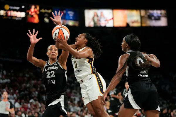 Sept. 21: The Indiana Fever's Kelsey Mitchell (0) attempts to score a layup against the Las Vegas Aces during Game 1 at Michelob Ultra Arena.