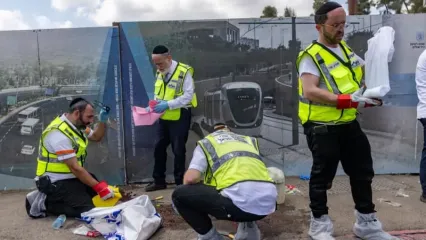 Police and rescue personnel at the scene of a terror attack at Ramot junction, near the entrance to Jerusalem, September 8, 2025. (photo credit: Chaim Goldberg/Flash90)