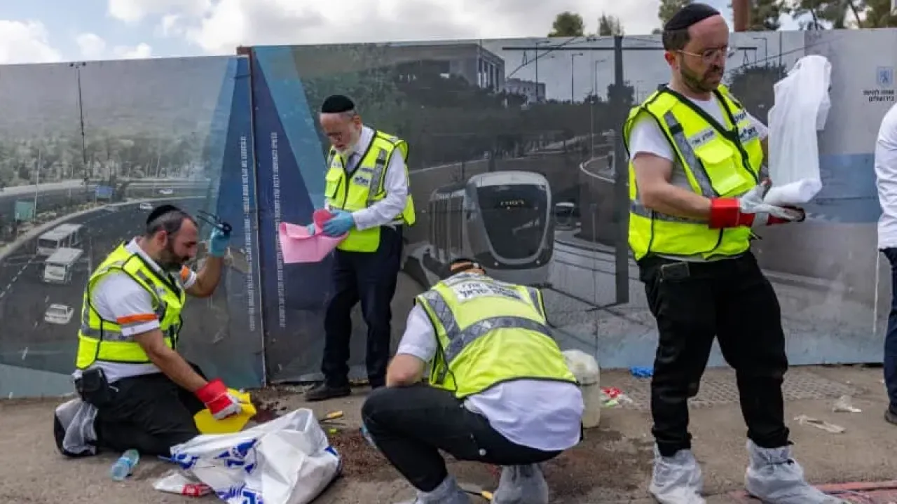 Police and rescue personnel at the scene of a terror attack at Ramot junction, near the entrance to Jerusalem, September 8, 2025. (photo credit: Chaim Goldberg/Flash90)
