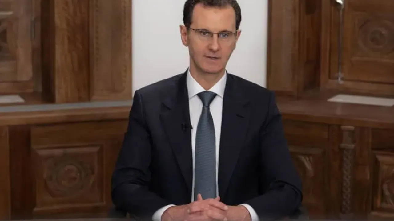 A photo released by the official Syrian Arab news agency (SANA) on 16 February shows then Syrian President Bashar al-Assad delivering a televised speech. -/SANA/dpa