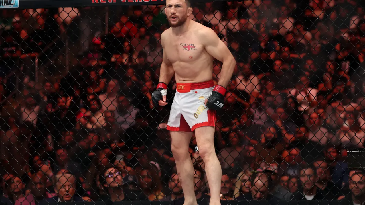 Jun 7, 2025; Newark, New Jersey, UNITED STATES; Merab Dvalishvili (red gloves) prepares to fight Sean O’Malley (not pictured) in a bantamweight title fight during UFC 316 at Prudential Center. Mandatory Credit: Vincent Carchietta-Imagn Images