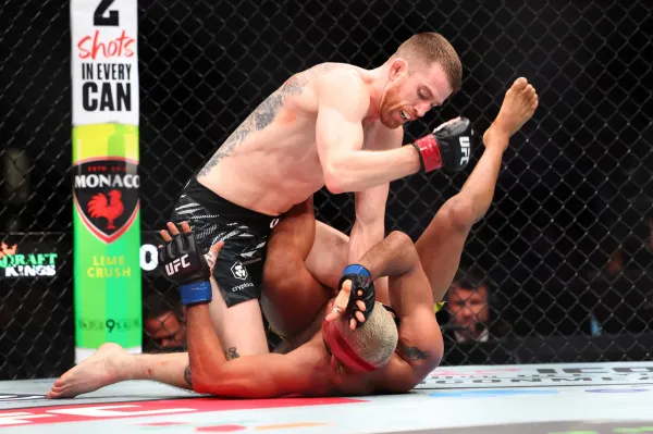 May 3, 2025; Des Moines, Iowa, UNITED STATES; Cory Sandhagen (red gloves) fights Deiveson Figueiredo (blue gloves) during UFC Fight Night at Wells Fargo Arena. Mandatory Credit: Reese Strickland-Imagn Images