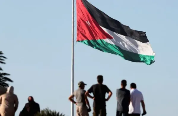 A Jordanian flag flies as people stand at the Roman Temple of Hercules during their visit to the Amman Citadel, an ancient Roman landmark, in Amman, Jordan August 17, 2025. (credit: REUTERS/MOHAMED ABD EL GHANY)