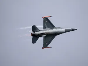 A grey fighter jet in the sky
