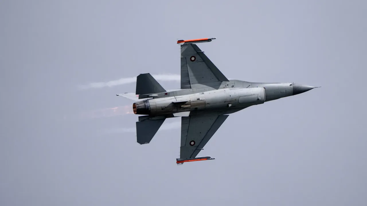 A grey fighter jet in the sky