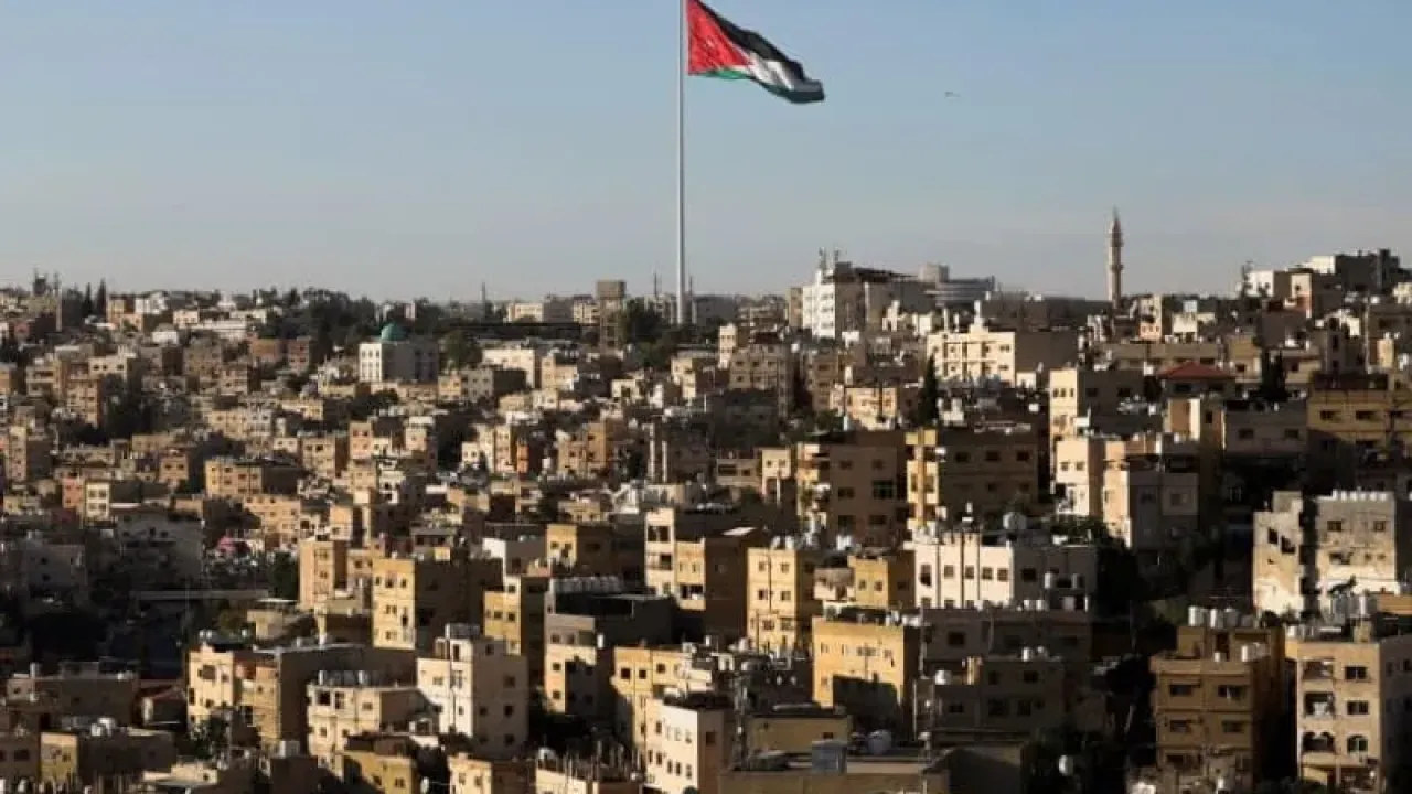 A Jordanian flag flies over the capital city, Amman, Jordan August 17, 2025. (photo credit: REUTERS/MOHAMED ABD EL GHANY)