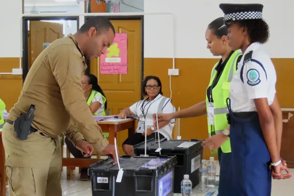 A police officer casts his vote at the English River School in Victoria, Seychelles, Thursday, Sept. 25, 2025. (AP Photo/Emilie Chetty)ASSOCIATED PRESS