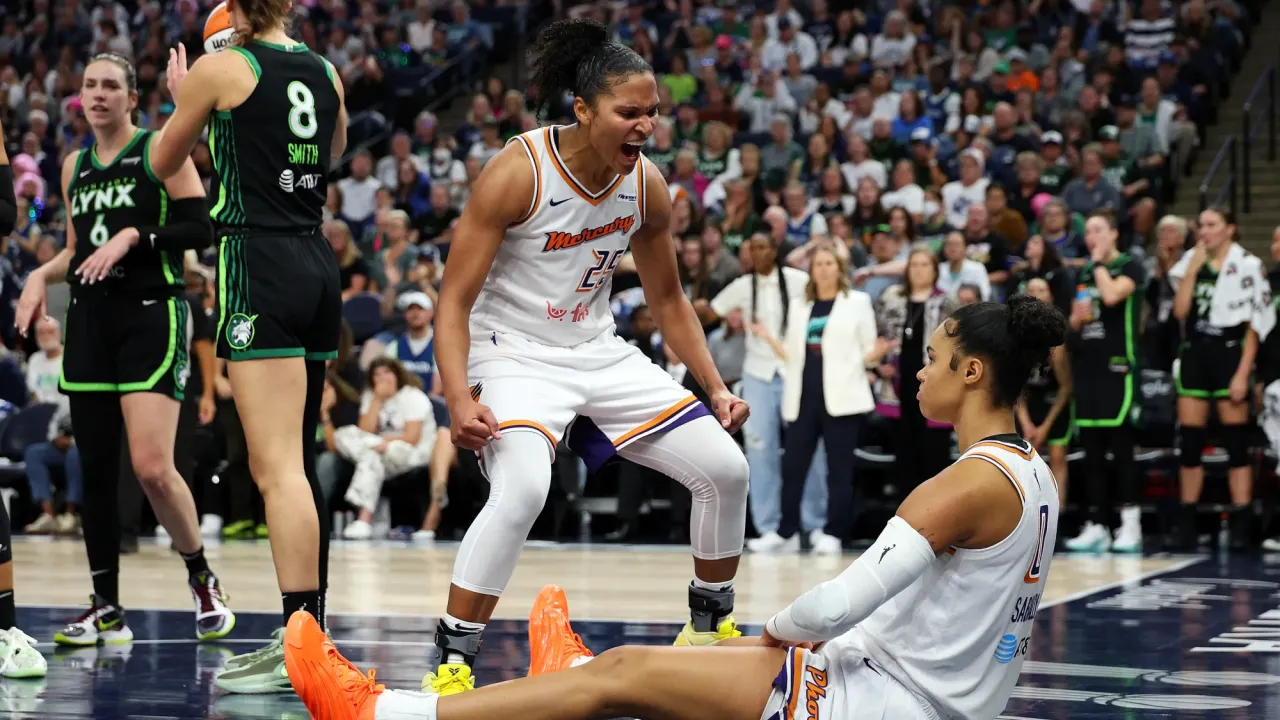 Alyssa Thomas and Satou Sabally celebrate during Game 2.