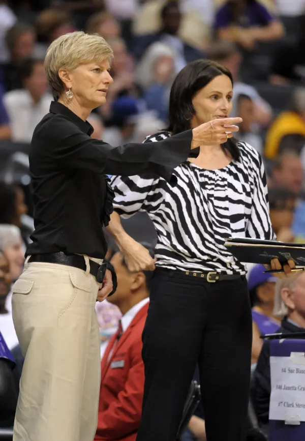 Assistant coach Sandy Brondello, right, talks with Los Angeles Sparks head coach Carol Ross during a WNBA game on June 18, 2012.