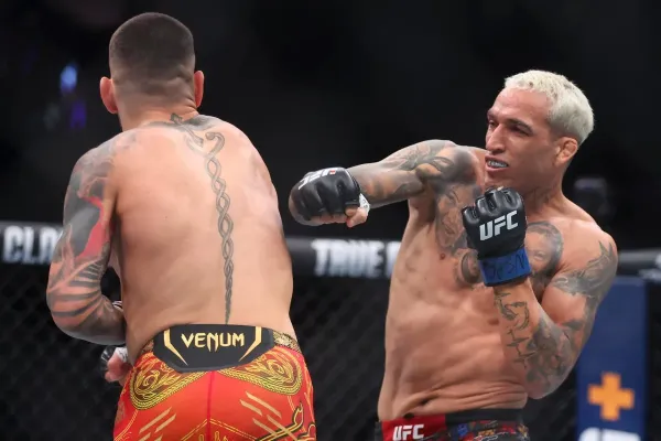 Charles Oliveira (right) during his most-recent fight, a knockout loss to Ilia Topuria (Getty Images)