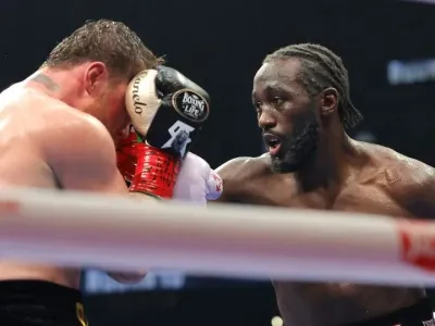 Crawford punches Canelo Álvarez in their undisputed super middleweight title fight. - Steve Marcus/Getty Images
