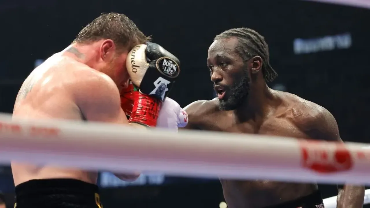 Crawford punches Canelo Álvarez in their undisputed super middleweight title fight. - Steve Marcus/Getty Images