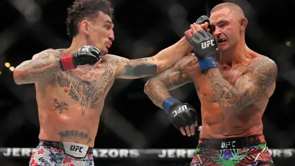 Dustin Poirier (right) during his retirement fight, a decision loss to Max Holloway in July (Getty Images)