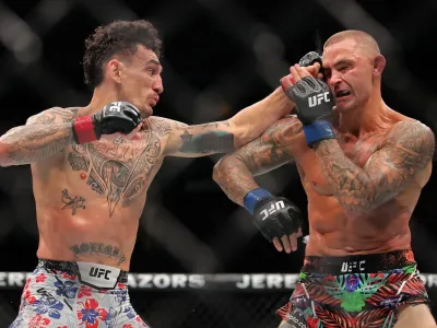 Dustin Poirier (right) during his retirement fight, a decision loss to Max Holloway in July (Getty Images)
