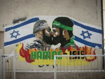 Grafitti shows terrorists from Hamas and ISIS kissing, in south Tel Aviv, September 29, 2024 (credit: MIRIAM ALSTER/FLASH90)