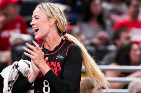 Indiana Fever guard Sophie Cunningham celebrates from the bench.