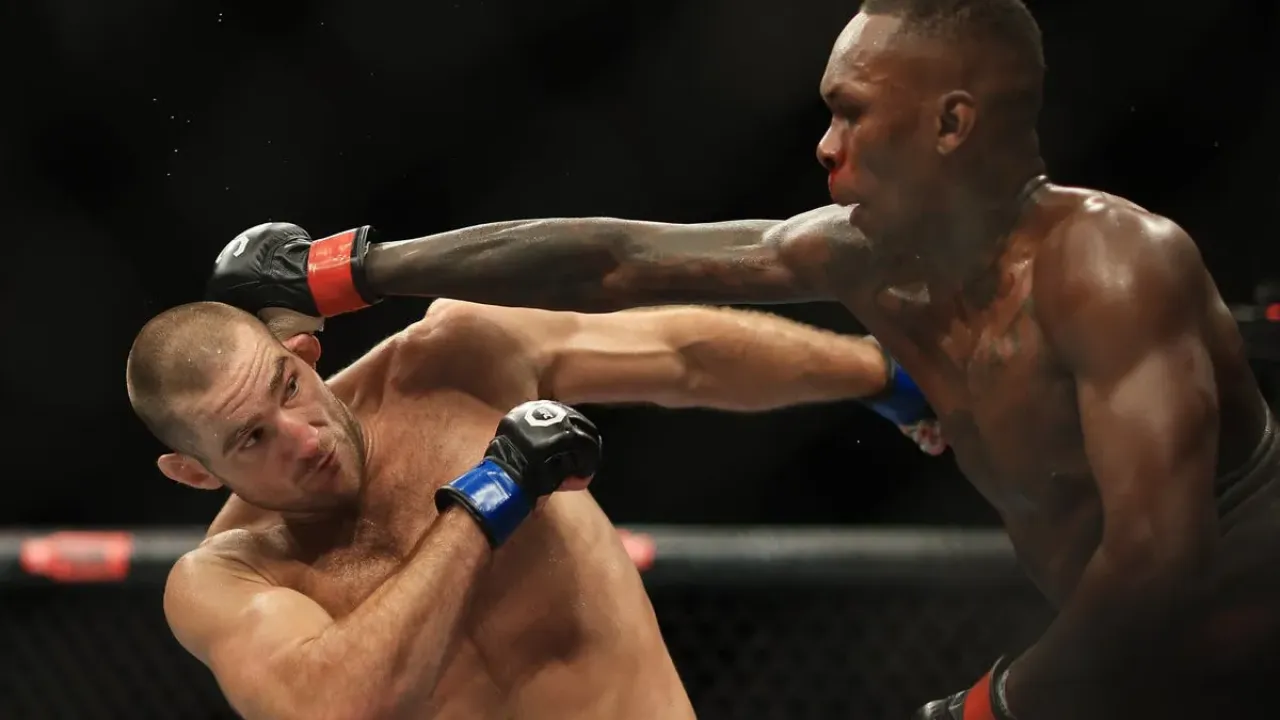 Israel Adesanya (right) was, surprisingly, easily outpointed by Sean Strickland in 2023 (Getty Images)