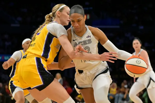Las Vegas Aces center A'ja Wilson is defended by Los Angeles Sparks forward Cameron Brink.