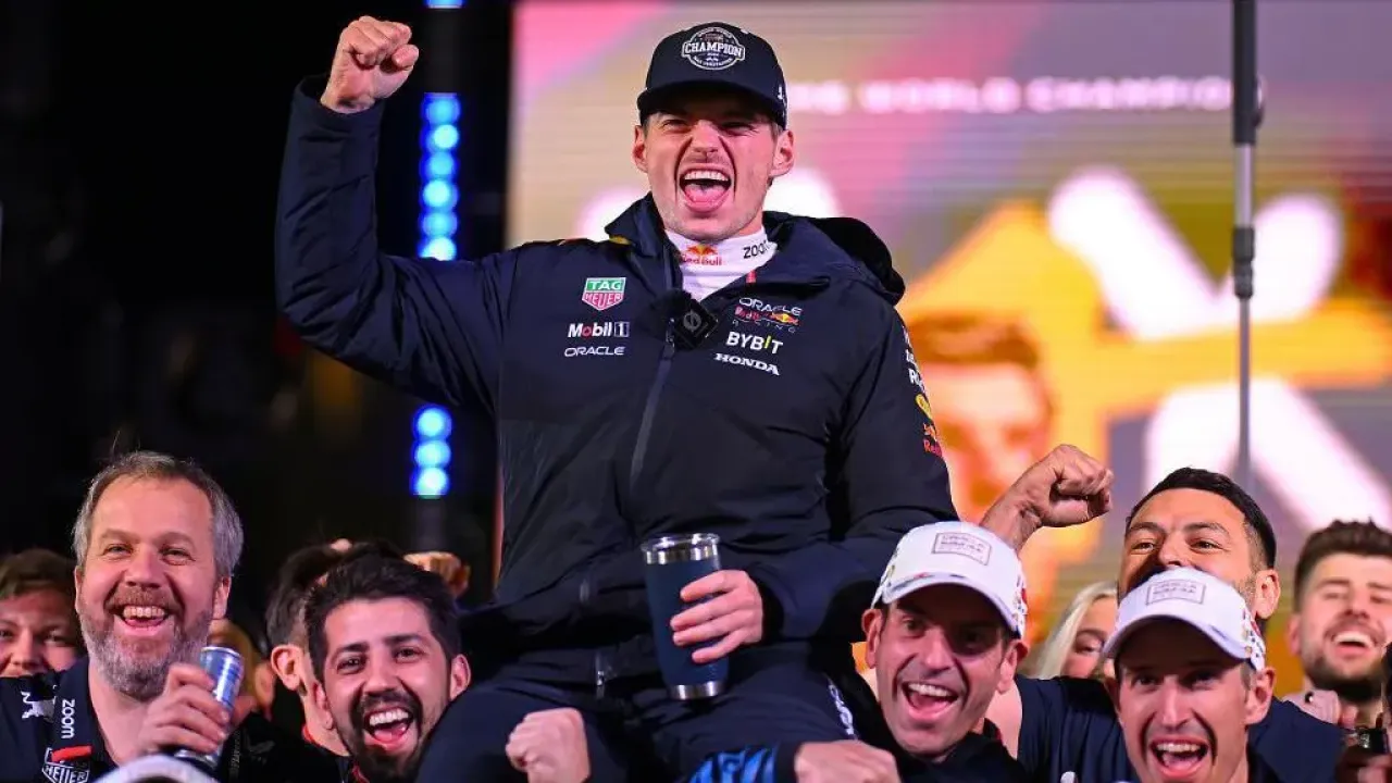 Max Verstappen celebrates his fourth championship victory in Vegas with his team