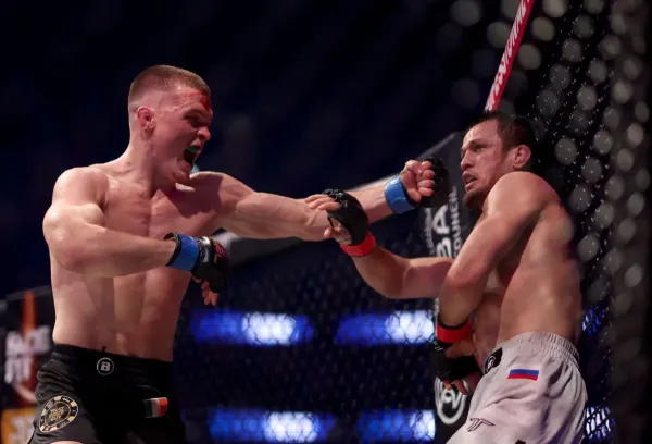 Paul Hughes (left) took undefeated champion Usman Nurmagomedov to the limit in their first fight (Getty Images)