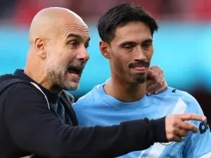Pep Guardiola and Tijjani Reijnders