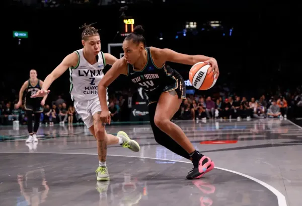 The Liberty’s Betnijah Laney-Hamilton drives on Natisha Hiedeman of the Minnesota Lynx. Michelle Farsi/New York Post
