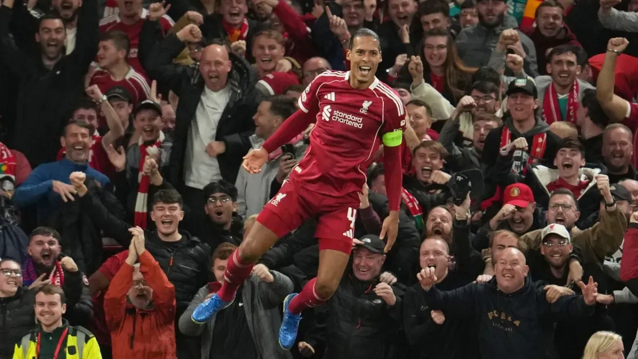Virgil van Dijk scored in stoppage time to secure a 3-2 win for Liverpool in the Champions League (AP)