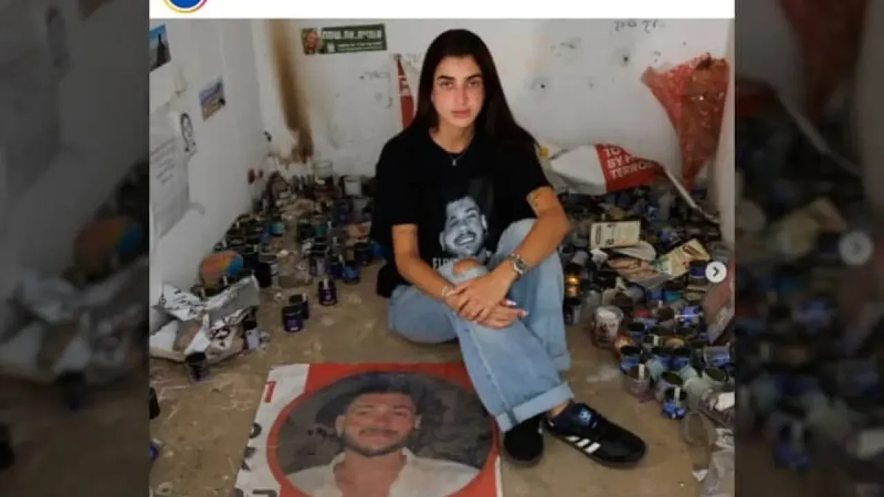 Ziv Abud with the hostage poster for her partner, Elia Cohen (credit: Screenshot/Instagram)