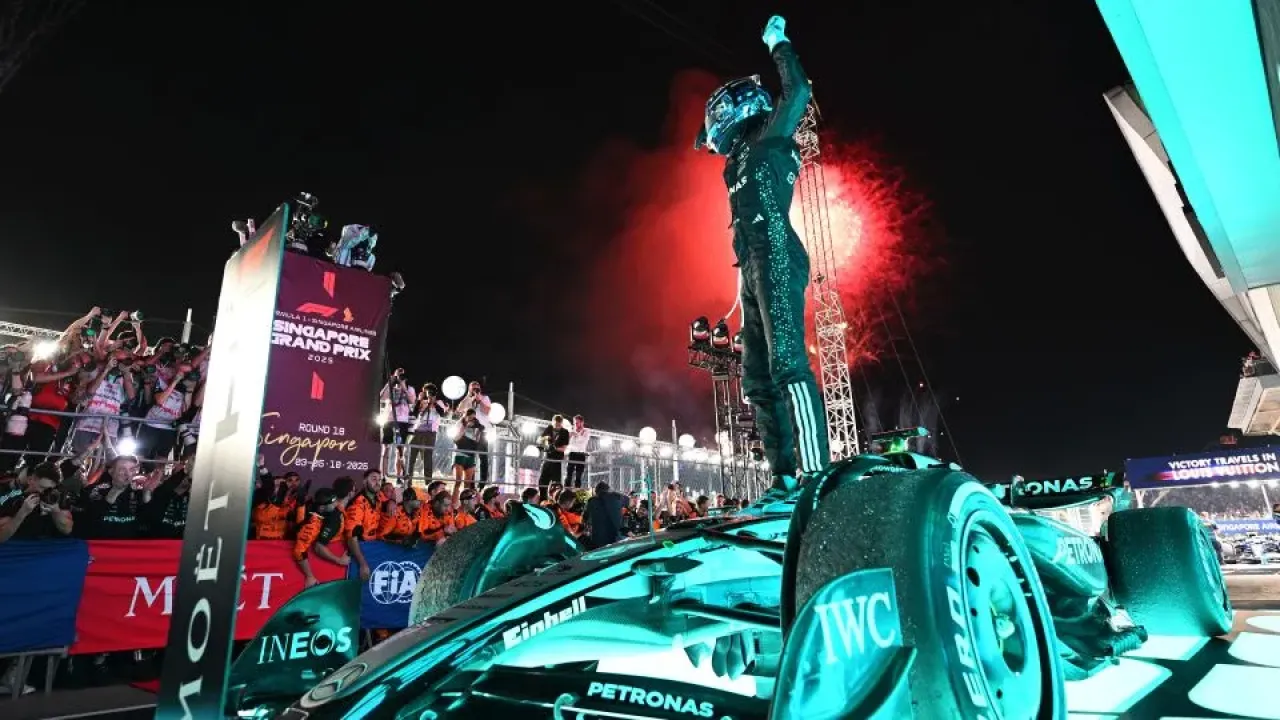 Race winner George Russell of Great Britain and Mercedes AMG Petronas F1 Team celebrates during the F1 Grand Prix of Singapore at Marina Bay Street Circuit today. - Mark Sutton/ Getty Images