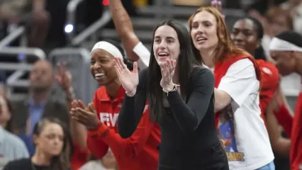 Indiana Fever&#39;s Caitlin Clark cheers during the second half of a WNBA basketball game against the Chicago Sky, Friday, Sept. 5, 2025, in Indianapolis. (AP Photo/Darron Cummings)