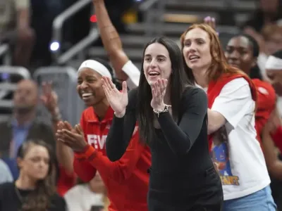 Indiana Fever&#39;s Caitlin Clark cheers during the second half of a WNBA basketball game against the Chicago Sky, Friday, Sept. 5, 2025, in Indianapolis. (AP Photo/Darron Cummings)