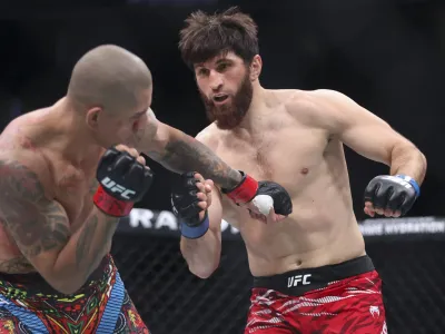 LAS VEGAS, NEVADA - MARCH 08: Alex Pereira of Brazil (L) punches Magomed Ankalaev of Russia  in a light heavyweight title fight during UFC 313 at T-Mobile Arena on March 08, 2025 in Las Vegas, Nevada. (Photo by Ian Maule/Getty Images)