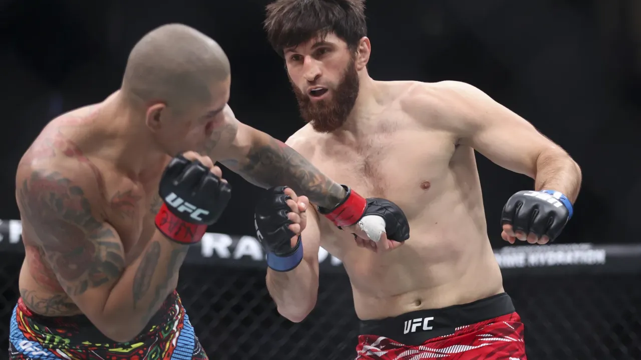 LAS VEGAS, NEVADA - MARCH 08: Alex Pereira of Brazil (L) punches Magomed Ankalaev of Russia  in a light heavyweight title fight during UFC 313 at T-Mobile Arena on March 08, 2025 in Las Vegas, Nevada. (Photo by Ian Maule/Getty Images)