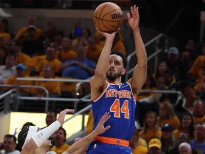 New York Knicks guard Landry Shamet (44) shoots a layup over Indiana Pacers guard Andrew Nembhard (2) during the second quarter of game three of the eastern conference finals for the 2025 NBA Playoffs at Gainbridge Fieldhouse