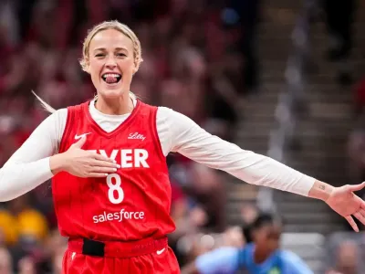 Indiana Fever guard Sophie Cunningham (8) celebrates Friday, July 11, 2025, during a game between the Indiana Fever and the Atlanta Dream at Gainbridge Fieldhouse in Indianapolis. The Indiana Fever defeated the Atlanta Dream, 99-82.© Grace Smith&sol;IndyStar &sol; USA TODAY NETWORK via Imagn Images
